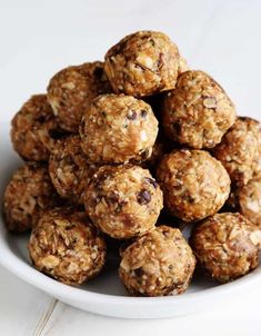 a white bowl filled with oatmeal energy bites