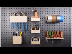 the pegboard is organized with various tools and supplies on it, including tape dispensers