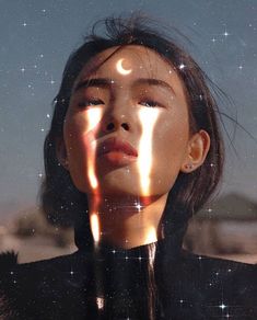 an instagram with the image of a woman's face and light coming from her eyes