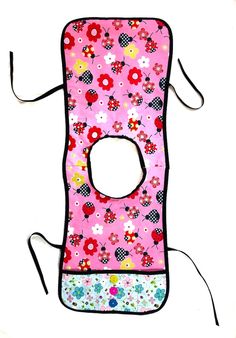 a child's bib with flowers on it