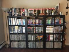 a large book shelf filled with lots of movies