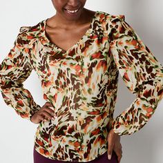 This Brannan women's v-neck blouse features a beautiful print, ruffled shoulder detail and long puffed sleeves for a feminine look and feel. Wear it with a pair of slacks to the office or with jeans and sandals for a casual day out. Closure Type: Pullover HeadFit: Regular FitNeckline: V NeckSleeve Length: Long SleeveApparel Length: 25 InchesFiber Content: 100% PolyesterFabric Description: WovenLining Material: PolyesterCare: Machine Wash, Line DryCountry of Origin: Imported Stretch V-neck Multicolor Blouse, Multicolor Stretch V-neck Blouse, Stretch Multicolor V-neck Blouse, Multicolor V-neck Workwear Blouse, Multicolor V-neck Blouse For Work, Elegant Multicolor Fall Tops, Long Puff Sleeves, Feminine Look, Puffed Sleeves