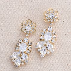 Meet our stunning LALE Earrings with Swarovski crystals. Featuring round and marquise shaped Swarovski crystals creating a unique design and a gorgeous pair of earrings! The LALE Earrings are a daintier version of our CEMILE earrings!. Our LALE Earrings are a perfect pair to add the right amount of sparkle to your look on your special day! The shine on these earrings is impeccable. Handcrafted with the Highest Quality Materials Swarovski Crystals Platinum plated - Guards against scratches and ta Dazzling Crystal Earrings With Sparkling Stones, Sparkling Crystal Earrings, Dazzling Crystal Diamond Earrings, Dazzling Crystal Diamond Earrings With Sparkling Stones, Crystal Cluster Drop Earrings With Sparkling Stones, Dazzling Crystal Embellished Cubic Zirconia Earrings, Sparkling Dazzling Crystal Earrings, Dazzling Sparkling Crystal Cluster Earrings, Dazzling Jeweled Crystal Earrings