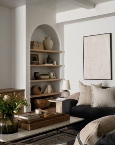 a living room filled with furniture and decor