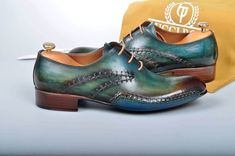 TucciPolo Prestigiously Handcrafted Burnished Greenish Brown Luxury Oxford Mens Italian Leather Shoes - offering superior comfort and exquisite design. Shop TucciPolo Collection of top quality mens Luxury Handmade Italian leather designer Shoes. Leather : Hand polish Italian Leather Sole: Double Leather Sole Construction: Oxford hand welted sole & sides Stitched Color: Burnished Greenish Brown This is a made-to-order product. Each pair will be made upon receipt of order and shipped in approx Formal Green Oxfords With Leather Lining, Elegant Green Dress Shoes With Leather Lining, Green Leather Dress Shoes With Goodyear Welt, Green Leather Shoes With Almond Toe And Leather Lining, Green Leather-lined Dress Shoes For Formal Occasions, Luxury Green Leather Shoes With Rubber Sole, Business Green Leather Shoes With Goodyear Welt, Green Goodyear Welted Leather Shoes, Green Goodyear Welted Leather Shoes For Business