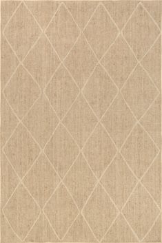 a beige rug with diamond shapes on it