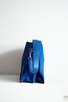 Royal Blue Phoebe Philo era ponyhair shoulder bag with toggle closure. Two main compartments with zip closure middle compartment and four side pockets Phoebe Philo Celine Bags, Luxury Blue Bucket Bag With Double Handle, Luxury Blue Top Handle Hobo Bag, Luxury Blue Hobo Bag With Top Handle, Modern Blue Hobo Bag With Top Handle, Blue Rectangular Bucket Bag With Detachable Handle, Blue Top Handle Hobo Bag With Detachable Handle, Blue Rectangular Hobo Bag With Removable Pouch, Modern Blue Hobo Bag With Double Handle