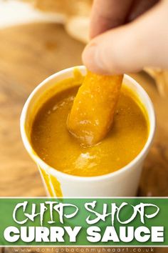 a person dipping some kind of food into a cup with the words chip shop curry sauce on it