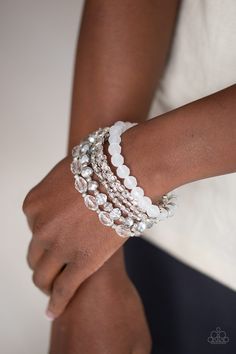 Infused with silver accents, a glassy collection of white and metallic crystal-like beads are threaded along stretchy bands around the wrist for a whimsically layered look. Sold as one set of six bracelets. p9wh-wtxx-206xx RELEASED 12 MAR 20 Paparazzi Accessories Jewelry, Bracelet Set Silver, Buy Crystals, White Bracelets, Crystal Accessories, Paparazzi Accessories, Flower Accessories, Paparazzi Jewelry, Fabric Jewelry