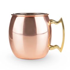 a shiny metal cup with a gold handle