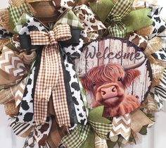 a welcome wreath with a cow on it