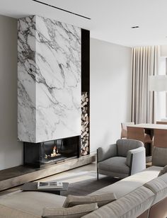 a living room filled with furniture and a fire place next to a wall mounted tv