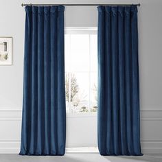 a blue curtain hanging in front of a window