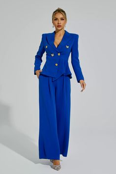 Elevate your style with the Viola Blue Butterflies Button Blazer Set. Designed for the refined woman, this two-piece ensemble features a blazer adorned with a floral button and butterfly embellishments. The set also includes a pair of elegant, irregularly cut trousers. Make a statement with this sophisticated and fashionable attire.  Top Length: Approx 62cm Pants Length: Approx 111cm Materials: Polyester Gentle Dry Clean Only  The model is 5 ft 7 and wears size S  Color may vary due to lighting Svecane Haljine, Refined Woman, Glitter Wedding Dress, Blazer Pattern, Blue Butterflies, Bandage Midi Dress, Woman Suit Fashion, Blazer Set, Floral Shirt Dress