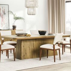 a dining room table with chairs around it