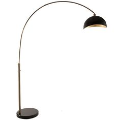 a black and gold floor lamp on a white background with the light turned off to show its dim lighting