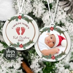 an ornament hanging from a christmas tree with baby's feet on it