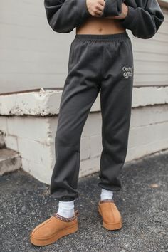 The Out of Office Set includes a hoodie with a kangaroo pocket & "Out of Office Graphic" on the front, and joggers with an elastic waist & ankles, pockets & an "Out of Office" graphic on the thigh. Self: 94% Polyester, 6% Cotton Contrast: 65% Polyester, 35% Cotton Hand Wash Cold, Hang Dry Casual Letter Print Joggers For Loungewear, Casual Letter Print Sweatpants For Loungewear, Relaxed Fit Letter Print Joggers, Cozy Joggers With Elastic Waistband For Streetwear, Casual Gray Joggers For Winter, Casual Gray Winter Joggers, Relaxed Fit Sweats With Kangaroo Pocket For Leisure, Casual Cozy Fit Sweats For Jogging, Relaxed Fit Activewear For Jogging With Letter Print