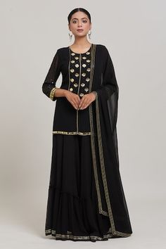 Black and gold acrylic embroidered short kurta. Paired with a ruffled sharara and embroidered border dupatta. - Aza Fashions Black Palazzo Set With Gota Work, Elegant Black Salwar Kameez With Gota Work, Black Palazzo Set With Gota Work For Eid, Elegant Black Anarkali Set With Gota Work, Designer Black Sharara With Gota Work, Elegant Black Sharara With Gota Work, Black Palazzo Set With Gota Work For Festive Season, Black Palazzo Set With Gota Work For Festive Occasions, Festive Black Palazzo Set With Gota Work