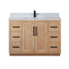 a bathroom vanity with drawers and a sink