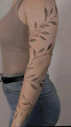 a woman with a tattoo on her arm