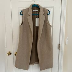 Long Vest Blazer / Sleeveless Coat Soft Tan Fabric, With Pockets Never Worn Beige Sleeveless Sweater Vest With Pockets, Sleeveless Beige Outerwear With Pockets, Beige Sleeveless Outerwear With Pockets, Sleeveless Outerwear For Fall Workwear, Sleeveless Fall Workwear Outerwear, Sleeveless Beige Outerwear For Work, Beige Sleeveless Outerwear For Work, Beige Winter Workwear Vest, Spring Sleeveless Neutral Vest