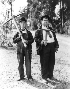 two boys are holding baseball bats in their hands