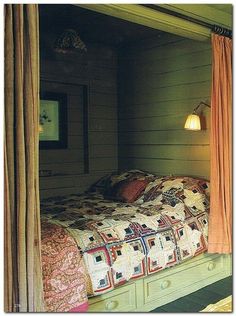 a bed sitting inside of a bedroom next to a window