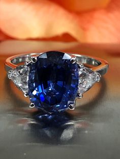 Excited to share this item from my #etsy shop: Oval Ceylon Blue Sapphire And Trillion Accents Set In A Basket Style Setting  In 14K White Gold  #5629 Ceylon Blue Sapphire, Basket Style, Purple Amethyst Ring, Yellow Engagement Rings, Rustic Bathrooms, Sapphire Engagement Ring Blue, Yellow Gold Engagement Rings, Blue Sapphire Rings, Sapphire Jewelry