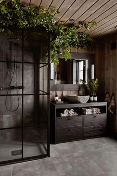 a bathroom with a shower, sink and mirror in it's centerpieces