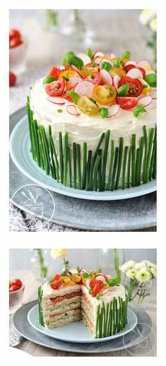 the cake is decorated with fresh flowers and green grass as well as sliced into slices