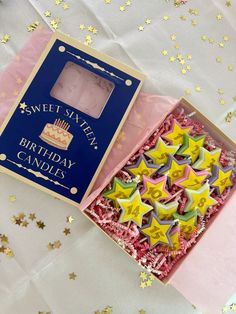 a birthday card in a box with stars on it