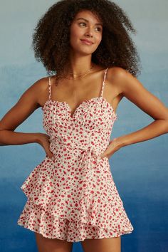 This one-piece wonder combines the playfulness of a romper with the romantic flow of an asymmetrical skirt, adorned with a delightful floral pattern. Effortlessly versatile, it's an ode to free-spirited style that takes you from day to night with ease. Free Spirit Style, Ruffle Romper, Asymmetrical Skirt, Day To Night, Floral Ruffle, To Night