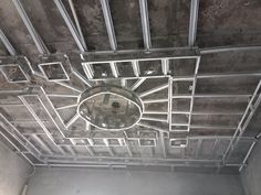 the ceiling in an unfinished room has metal bars on it