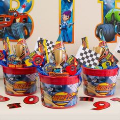 cars birthday party favors and cupcakes in buckets