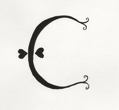 a black and white drawing of a circle with two hearts on it's side