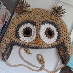 a crocheted owl hat with big eyes