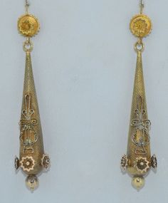 A lovely lengthy pair of Georgian era earrings. These earring are crafted from 14K Yellow gold. The tops appear to have been conversion to hooks, most likely they were day and night earrings. The decoration at the front is original the hooks appear to have been replaced. The tops feature a flower with a textured background. They suspend the long drop The drops are decorated with lovely appliqués in 14K yellow gold with a textured background. They match the tops. These earrings are in good condit Formal Filigree Drop Danglers, Formal Filigree Danglers Drop Earrings, Hallmarked Dangle Earrings For Evening, Victorian Chandelier Earrings For Formal Occasions, Antique Yellow Gold Ceremonial Earrings, Antique Teardrop Pierced Earrings, Antique Ceremonial Dangle Earrings, Antique Teardrop Earrings, Antique Dangle Earrings For Ceremonies