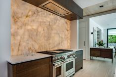 a kitchen with an oven, stove and counter top in it's center area