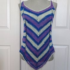 "Soft cotton yarn makes up this delightful and playful striped summer tank top.  Perfect weight for the season with a flattering diagonal stripe pattern on both front and back. The color and pattern is royal blue,light blue and purple striping which follows the dictate of the colors in the yarn.  It will fit a woman's size  medium.  Top can be worn over a bathing suit, camisole or halter top layered. or by itself.   Measurements: ( taken lying flat)                               Bust, 36\"- 38\"                               Hip Area  36\"-40\"                               Under Arm Side  12 1/2\", over all length from shoulder to peak on hem is 28\". There is comfortable stretch in excess of those measurements giving the top a wonderful drape. All of my tank tops and camisoles are hand k Striped Knitted Cotton Top, V-neck Crochet Tank Top For Beach, Striped Knitted Tops For Summer, Beach Crochet Cami Top, Summer Striped Knit Top For Beach, Crochet Cami Top For Beach, Striped Knit Top For Summer Beach, Striped Knit Top For Summer Beach Outings, Striped Summer Tops For The Beach