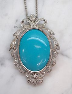 Metal: 14kt White Gold Stone: Diamond And Turquoise Shape: Round And Oval Turquoise Weight: 62 ctw, 39.53 x 29.83 mm Diamond Weight: 1.14 ctw Weight of entire piece with chain: 32.30 grams Length Of Pendant From Top To Bottom: 65.60 mm Width Of Pendant: 45.56mm Type of Chain: 1.60mm Wheat Chain. Length Of Chain: 16 Inches Type Of Closer: Lobster Clasp Customization: We can make this piece in any color gold or gem combination. Note: We have 100s of chains to choose from instead, or we can sell th Collectible Blue Turquoise Gemstone Necklace, Elegant Turquoise Cabochon Pendant Necklace, Luxury Turquoise Necklace With Cabochon, Luxury Turquoise Oval Necklace, Elegant Round Turquoise Cabochon Necklace, Luxury Turquoise Cabochon Jewelry, Elegant Turquoise Necklace With Oval Pendant, Elegant Oval Turquoise Jewelry, Elegant Blue Turquoise Necklace With Cabochon