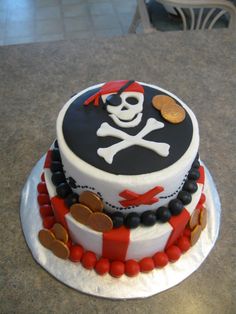 a decorated cake with a skull and crossbones on it