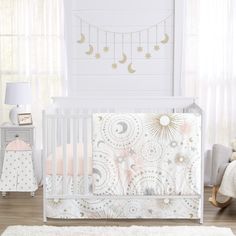 a baby's room with a crib, bedding and rugs on the floor