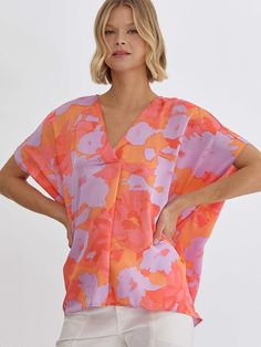 Lavender, Orange, and Coral Pattern Blouse Summer Orange V-neck Blouse, Tie Dye V-neck Top For Beach, Spring Floral Print Blouse With Kimono Sleeves, Summer Floral Print Blouse With Kimono Sleeves, Summer Blouse With Floral Print And Kimono Sleeves, Summer Split Neck Pink Blouse, Floral Print Blouse With Kimono Sleeves For Summer, Oversized V-neck Blouse For Spring, Summer V-neck Blouse With Vibrant Print