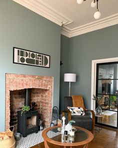 a living room filled with furniture and a fire place