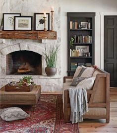 a living room filled with furniture and a fire place