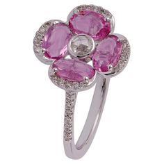 Rose cut Diamond surrounded by Oval Pink Sapphire Flower Ring 1 Rose cut Diamond - 0.06 CTS 4 Oval Pink Sapphire - 1.34 CTS 36 Round Brilliant Cut 0.22 CTS 18k White Gold. Elegant Pink Oval Flower Ring, Luxury Pink Rose Cut Diamond Wedding Jewelry, Pink Flower Ring With Rose Design, Pink Diamond Flower Shaped Ring, Pink Rose Design Flower Ring, Luxury Victorian Jewelry With Rose Cut Diamonds, Antique Pink Rose Cut Diamond Jewelry, Victorian Pink Rose Cut Diamond Jewelry, Pink Diamond Flower-shaped Ring