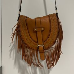 Only Worn Once Brown Tote Saddle Bag For Errands, Brown Crossbody Saddle Bag For Errands, Brown Saddle Tote Bag For Errands, Casual Brown Saddle Bag With Detachable Strap, Trendy Camel Shoulder Bag With Adjustable Strap, Light Brown Crossbody Shoulder Bag For Errands, Brown Fringe Bag For Everyday Use, Light Brown Shoulder Bag With Adjustable Strap For Errands, Chic Brown Fringe Hobo Bag