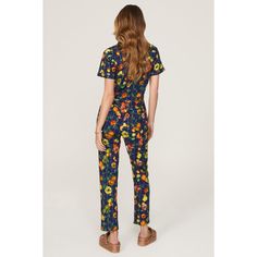 Multicolor printed cotton (100% Cotton). Jumpsuit. Short sleeves. Collar. Front zipper fly with button closure. 58" from shoulder to hemline. 28" inseam. 11.5" rise. 7" leg opening Imported. Patterned Printed Jumpsuits And Rompers For Spring, Spring Casual Multicolor Print Jumpsuits And Rompers, Retro Fitted Floral Print Jumpsuits And Rompers, Retro Floral Print Fitted Jumpsuits And Rompers, Cotton Floral Print Jumpsuits And Rompers For Loungewear, Cotton Jumpsuits And Rompers With Floral Print For Loungewear, Printed Short Sleeve Jumpsuits And Rompers For Spring, Retro Cotton Short Sleeve Jumpsuit, Retro Summer Workwear Jumpsuits And Rompers