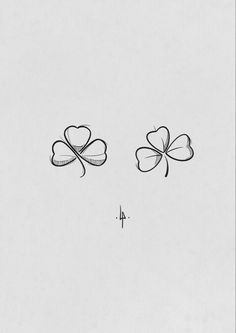 four leaf clover tattoo on the left side of the ear, with two smaller leaves attached to